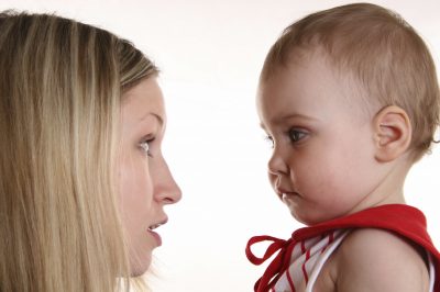 Mother talking with baby